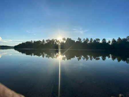 MYGIG123RF - view of water near the fishing village. Reflection of tree on the water. Besut.の写真素材