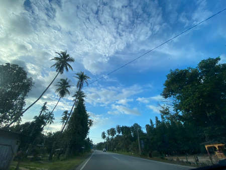 Peaceful weekday morning view on the road in Tembila.の写真素材