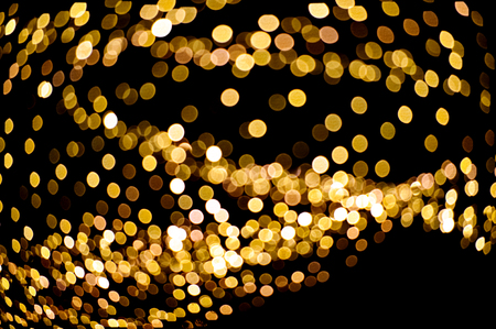golden blurred lights christmas illumination against night sky holiday background