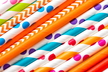 multicolored cocktail tubes close-up bright holiday backgroundの写真素材