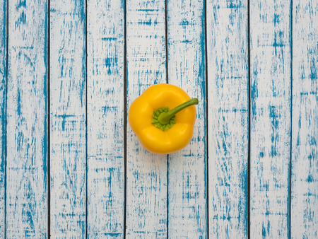 Fresh Bulgarian pepper lies on a wooden tableの写真素材