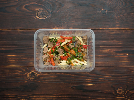 Pasta with turkey, bell pepper and cilantro to take awayの写真素材