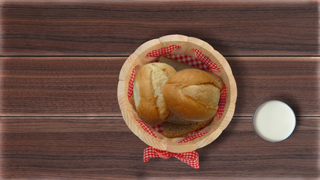 Buns in breadcrumbs on the kitchen tableの写真素材