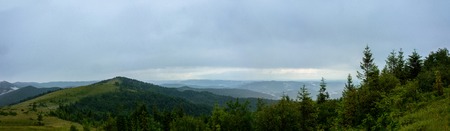 Amazing panorama on the mountain Yavorinka in the Ukrainian Carpathians during the rain. Amazing Panorama of Ukrainian Carpathiansの写真素材
