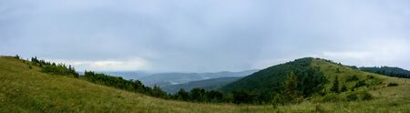 Amazing panorama on the mountain Yavorinka in the Ukrainian Carpathians during the rain. Amazing Panorama of Ukrainian Carpathiansの写真素材