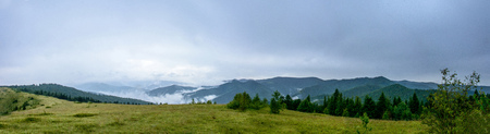 Amazing panorama on the mountain Yavorinka in the Ukrainian Carpathians during the rain. Amazing Panorama of Ukrainian Carpathiansの写真素材