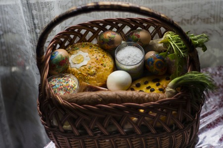 Ukrainian Easter basket filled with traditional festive dishes and who blessed the feastの写真素材