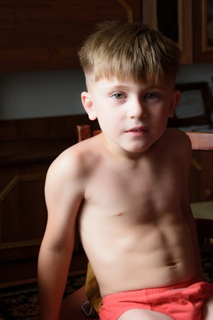 Conceived guy sitting on the chair in the room . Ukraineの写真素材
