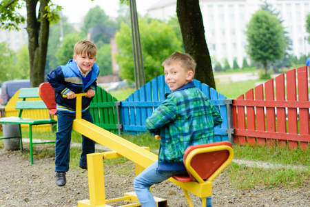 Ukrainian boys are playing in the courtyard near their homeの写真素材