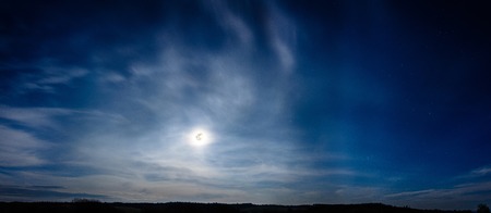 On a day of lunar eclipse in Ukraine over the mountains Carpathians, the moon looks very big and wonderfulの写真素材