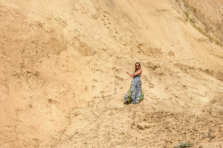 Photos of a wonderful woman in a beautiful dress that is resting on a Ukrainian beach in the Black Seaの写真素材