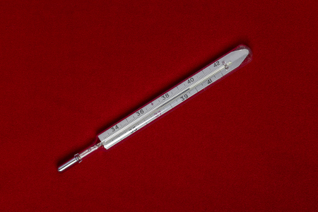 Packages of tablets are located on a red background with a place for the inscriptionの写真素材