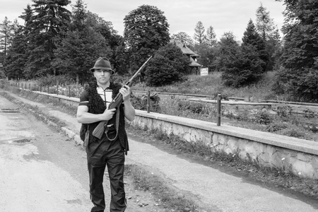 Ukrainian Hutsul man with a rucksack and a hat in the mountains 2018の写真素材