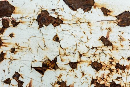 Excellent texture of rusty metal with cracked white and yellow paint 2018