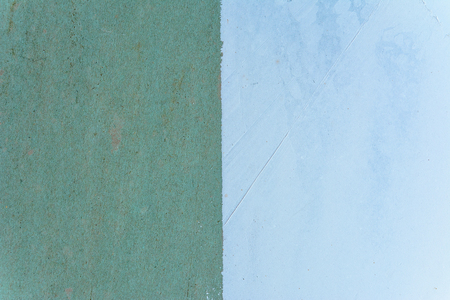 Magnificent background of the green wall is half painted with a white putty 2018の写真素材