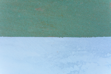 Magnificent background of the green wall is half painted with a white putty 2018の写真素材