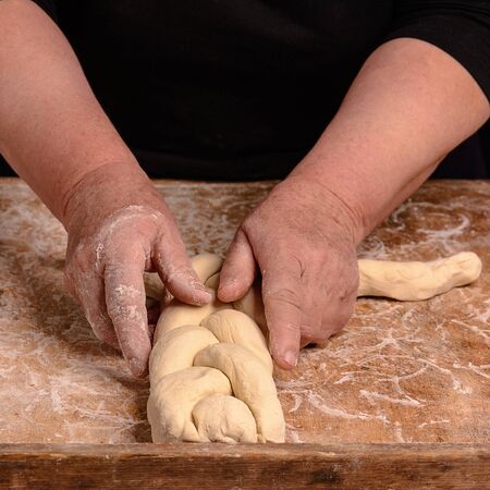 My grandmother makes a raw dough in a scab for baking 2018の写真素材