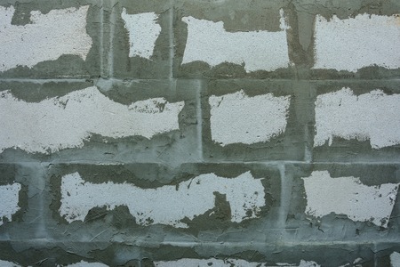 Gray wall of foam blocks on glutinous solutionの写真素材
