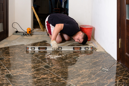 The master checks the tile surfaces tile levelの写真素材