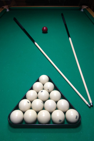 Billiard table and cue with white balls