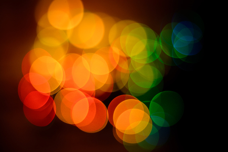 Round bokeh in red, yellow, green tones close up on New Year's Eve 2018の写真素材
