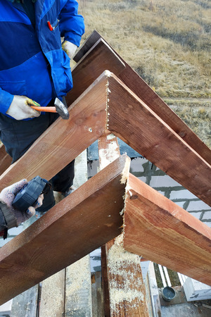 the worker shoots the rafters on the roof frame 2018の写真素材