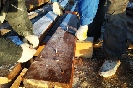 The sharp nail stuffed into the board looks like a sharp tip 2018の写真素材