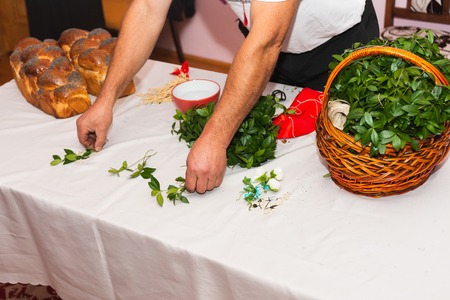 Green leaves are periwinkle in a basket on the table 2019の写真素材