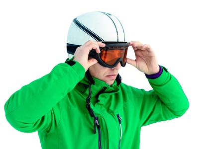 A man skier wearing a helmet and sunglasses before training for safetyの写真素材