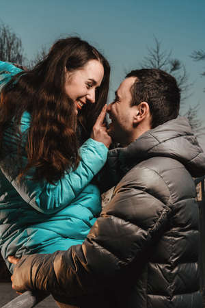 A meeting of lovers on Valentine's Day in the city park in the evening