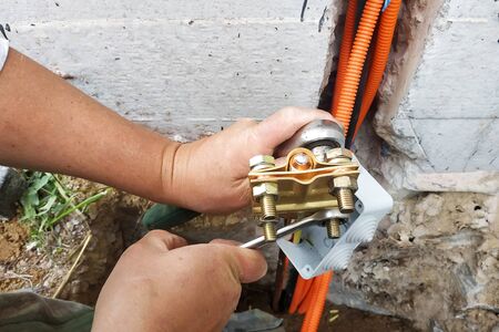 The master performs welding of a copper tube near a dwelling house. 2019