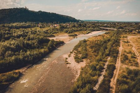 Beautiful landscape from the top shows the river and field in the countryside. 2019