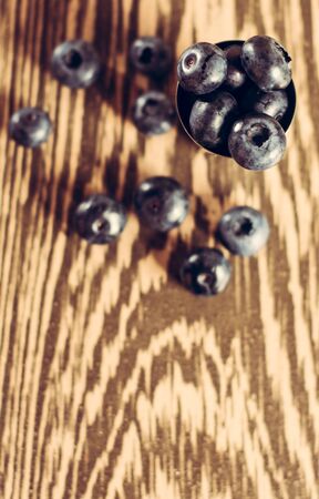 Blue berry is sweet and fragrant on a brown background. 2019の写真素材
