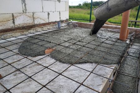 Pouring concrete after placing steel reinforcement to make a screed, the photo shows sewer pipes. 2019の写真素材