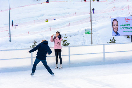 Bukovel, Ukraine February 12, 2019 - a man skates for the first time. 2019のeditorial素材