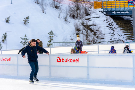 Bukovel, Ukraine February 12, 2019 - a man skates for the first time. 2019のeditorial素材
