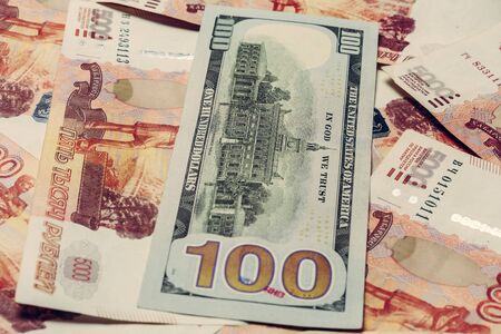 one hundred dollar bill lies on 5000 Russian rubles, the side where the hall of independence is depicted. 2019の写真素材