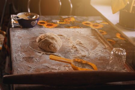 Cooking dumplings at home, dough and flour with dumplings on a wooden board.2020の写真素材