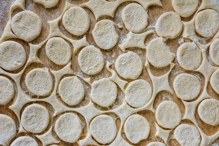Cut circles for dumplings, texture from the dough.2020