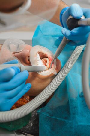 The patient visits the dentist for a dental ultrasound procedure at a dental clinic.