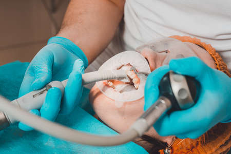 The dentist removes the tartar by ultrasound.2020の写真素材