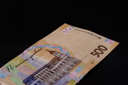 A lot of Ukrainian hryvnias, face value 500 hryvnias on a black background, nicely laid out money on black.2020の写真素材
