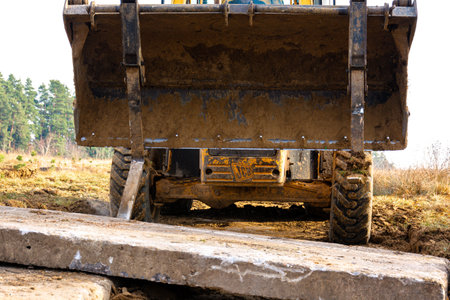 Trostyanets, Ukraine December 20: excavator transports concrete slabs to the yard.2020のeditorial素材