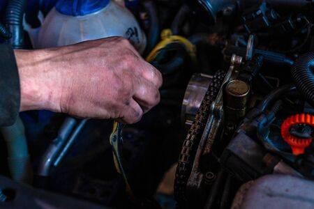 Car mechanic servicing car engine in car service closeup 2020の写真素材