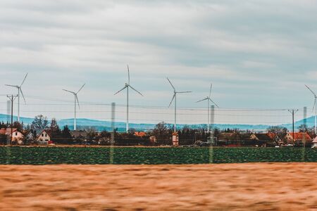 Windmills in mountain fields on the border of Germany and Poland 2020の写真素材