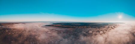 Beautiful panorama of winter village covered with dense fog from aerial view 2020の写真素材