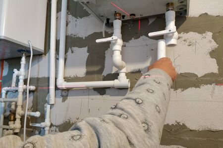 Worker is working on installing pipes for floor heating.2020の写真素材