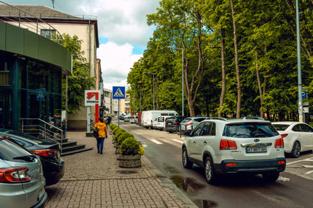 Restoration of life after quarantine. People in masks during a coronavirus pandemic. Parking on the street for military veterans. Ivano-Frankivsk, Ukraine - May 25 2020.のeditorial素材