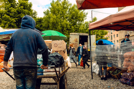 Opening of food markets in Europe during quarantine and the coronavirus pandemic. People violate social distance and do not wear medical masks 2021. Ivano-Frankivsk, Ukraine - May 25 2020.のeditorial素材