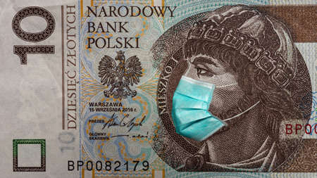 Banknote of 10 zlotych depicting polan Meshko in a medical mask during the economic crisis and pandemic of the coronavirus in Poland. Qualitative montage closeup.の写真素材